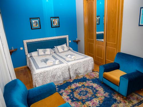 Кровать или кровати в номере Casa rural quiroga