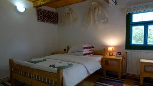 a bedroom with a bed and a window at Breb 418, Casa Opris in Breb