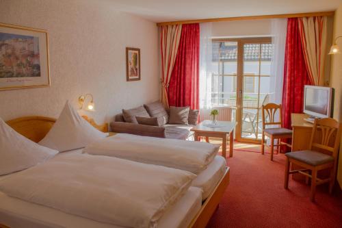 Postel nebo postele na pokoji v ubytování Hotel Pension Fleischmann
