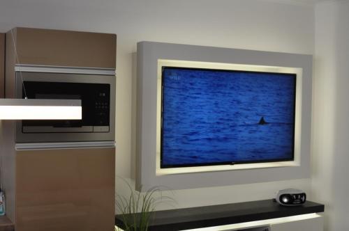 a television screen with a boat in the water at gyorapartman-TOP in Győr