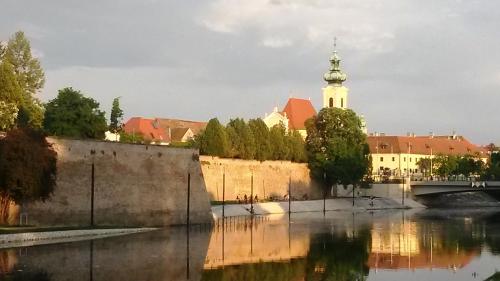 a view of a city with a bridge and a river at gyorapartman-TOP in Győr