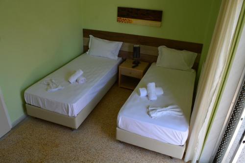 Ένα ή περισσότερα κρεβάτια σε δωμάτιο στο Apartments Dimitra