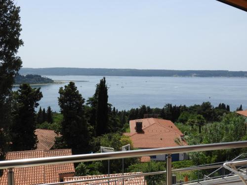 a view of the water from a house at Red Rose Apartment in Portorož