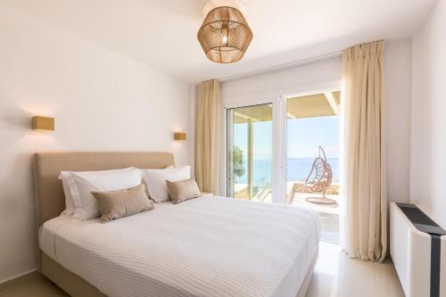 Voodi või voodid majutusasutuse Bolla D'Oro Luxury Villas toas