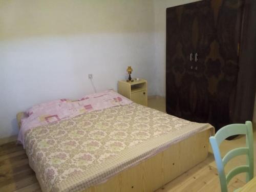 Una cama o camas en una habitación de Apartman DINKO