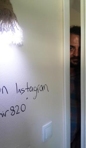 a sign on a wall with handwriting on it at Oludeniz Hostel in Fethiye