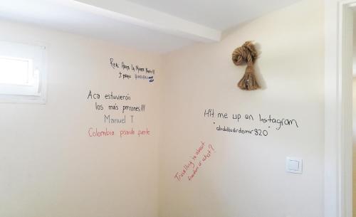 a room with writing on the wall at Oludeniz Hostel in Fethiye
