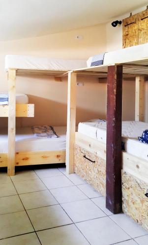 a room with three bunk beds in it at Oludeniz Hostel in Fethiye