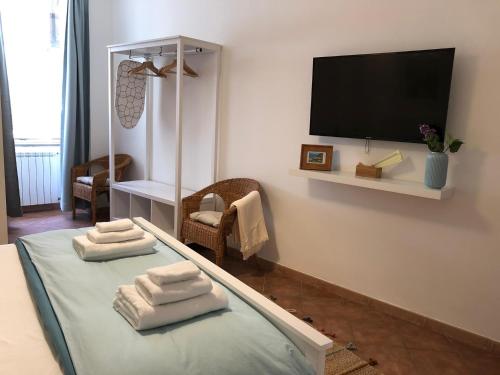 TV a/nebo společenská místnost v ubytování Pizzo Central House