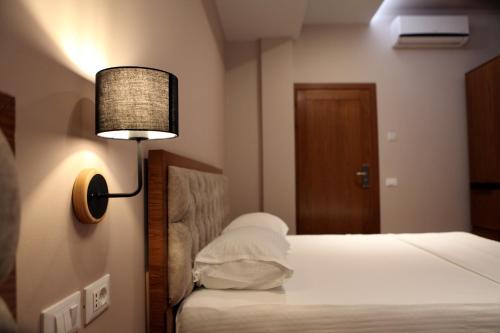 Postel nebo postele na pokoji v ubytování Hotel Pelikan