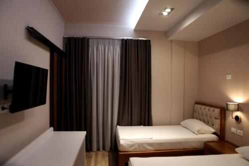 Postel nebo postele na pokoji v ubytování Hotel Pelikan