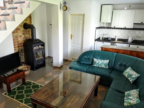 a living room with a couch and a wood stove at Villa Watamu in Trzęsacz
