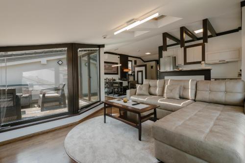 a living room with a couch and a table at Villa Varosh in Ohrid