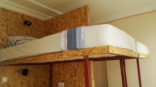 a bunk bed with a mattress on top of it at Oludeniz Hostel in Fethiye