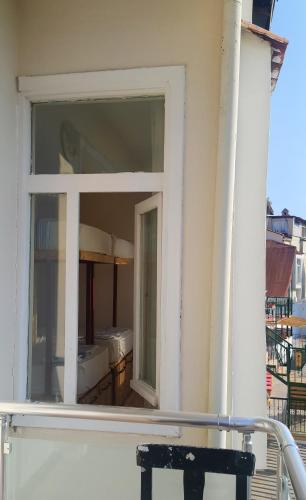 a window on the side of a building at Oludeniz Hostel in Fethiye