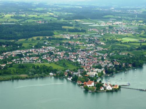an island in the middle of a large body of water at Hotel-Restaurant Walserhof in Wasserburg am Bodensee