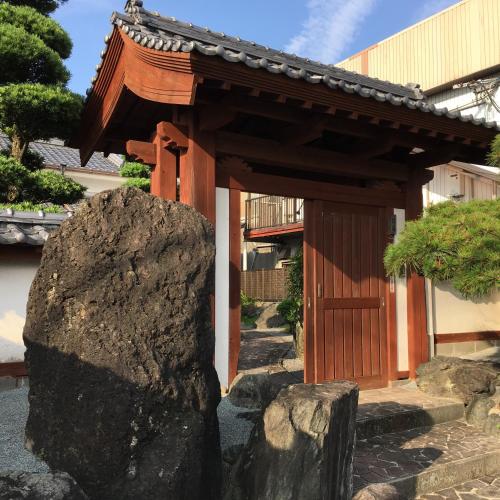 a small shrine with a rock in front of it at まるで一国一城の主 佐藤邸 in Nichinan