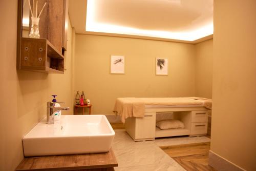 a bathroom with a sink and a bed at Premier Vista Hotel in Silivri