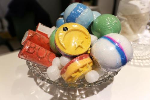 a glass bowl filled with different types of candy at Hotel Yam in Daejeon