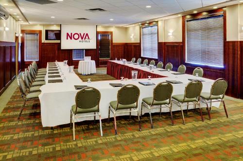 a large conference room with a long table and chairs at Chateau Nova Kingsway in Edmonton