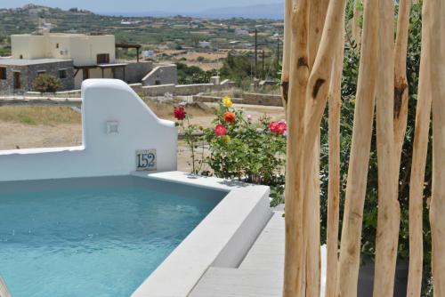 a swimming pool in a villa with a view at Villa kleio Naxian album with private pool in Glinado Naxos