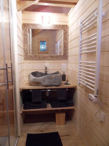 a bathroom with a sink and a mirror at Aura Cabana - Cabane spa perchée à 6 m de haut in Saint-André-dʼOlérargues