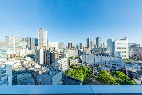 a view of a city skyline with tall buildings at Hotel Hanshin Annex Osaka in Osaka