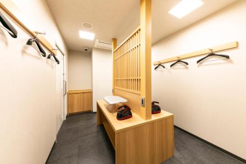 a room with a hallway with a stair case at Hotel Hanshin Annex Osaka in Osaka