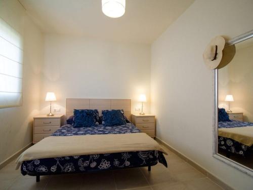Ένα ή περισσότερα κρεβάτια σε δωμάτιο στο Casa en L Escala con piscina y WIFI free