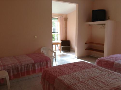 Postel nebo postele na pokoji v ubytování Hotel Tecozautla