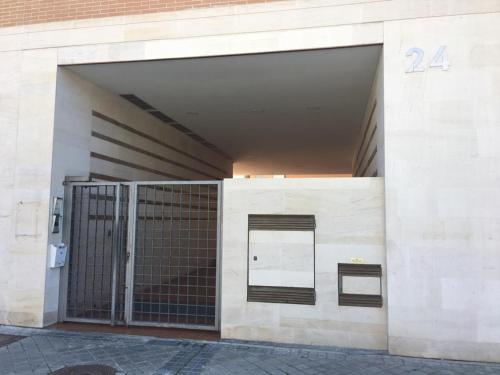 an open door of a building with a gate at VUT sencilla y cómoda en Ávila capital. in Avila