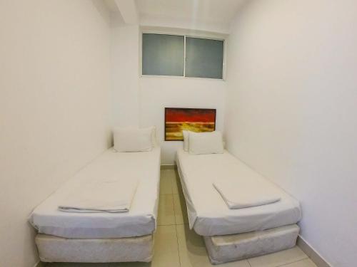 Cama o camas de una habitación en Romance Hills Hotel