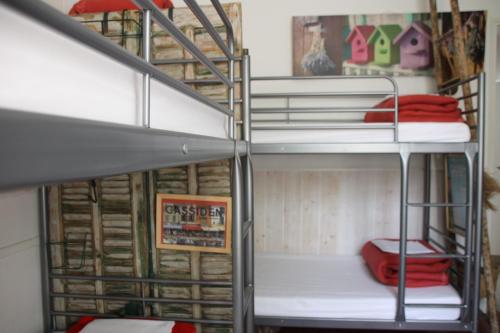 a couple of bunk beds in a room at Au Petit chez Soi in Cassis