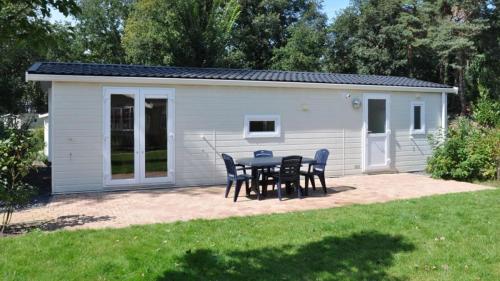 a table and chairs in front of a building at Holiday rentals in Velsen-Zuid