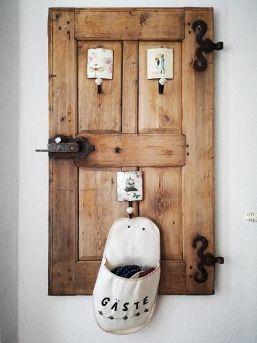 a wooden wall with a toilet on a wall at Millenium Inn Ferienwohnung in Mürzzuschlag