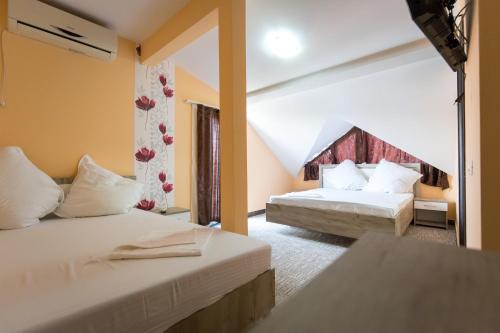 Postel nebo postele na pokoji v ubytování Vila Amalya