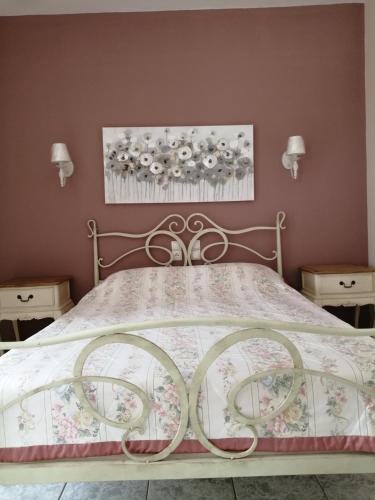 a bedroom with a bed with a floral bedspread at Villa Sophia in Mitikas