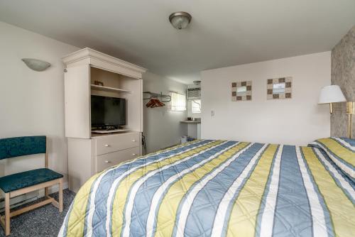 Postel nebo postele na pokoji v ubytování Ne'r Beach Motel