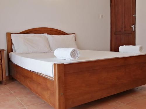 Ein Bett oder Betten in einem Zimmer der Unterkunft Kandy Highland Unique Hotel