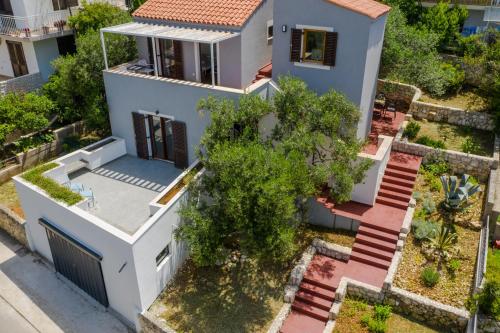 an aerial view of a house with a tree at Casa Dubi Hvar in Hvar