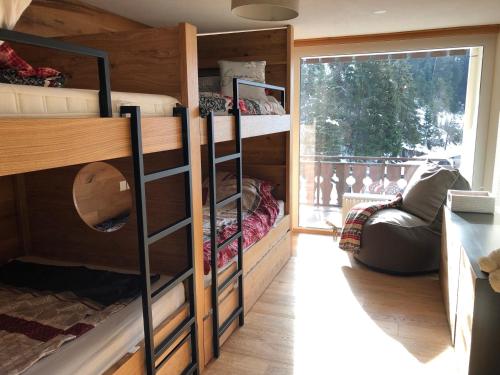 a bunk bed room with bunk beds in a house at Laax Flims Luxury Large apartment near Rock Resort in Laax-Murschetg