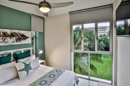 Tempat tidur dalam kamar di 207 La Ballito-Luxury Family apartment