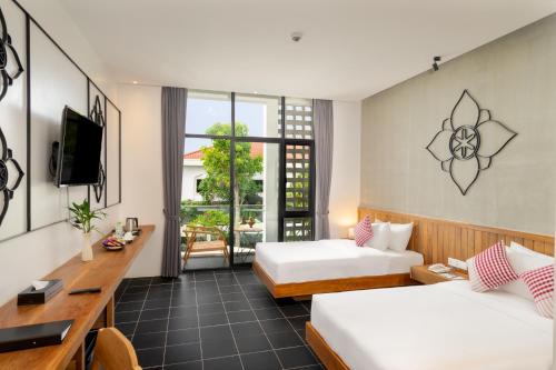Postel nebo postele na pokoji v ubytování Phka Chan Hotel