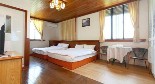 Giường trong phòng chung tại The Country B&B