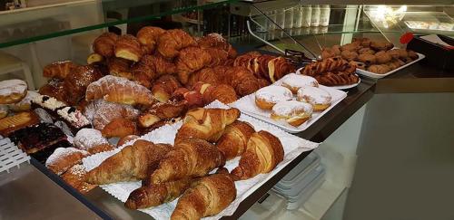 a display case filled with different types of pastries at Risorgimento - Albergo - Bar in Morciano di Romagna