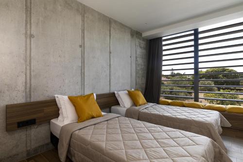 Katil atau katil-katil dalam bilik di Momentum Villas