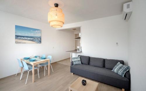 a living room with a couch and a table at Sunrise Apartments Bol in Bol