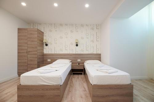 Ένα ή περισσότερα κρεβάτια σε δωμάτιο στο Hotel Liad City Center