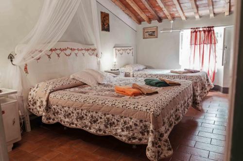 Un pat sau paturi într-o cameră la Agriturismo Corboli