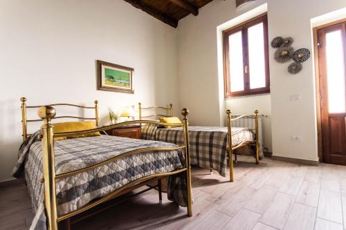 Postel nebo postele na pokoji v ubytování Cascina al Ponte